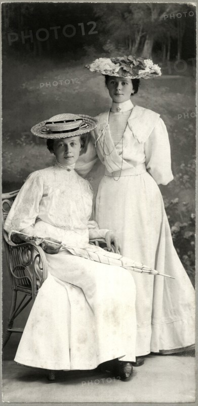 Two Women in White Dresses and Hats, One Seated Holding Parasol, Portrait, Stuttgart, Germany, circa 1900,