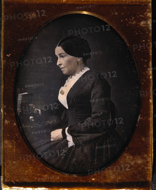 Woman Sitting in Chair Holding Book, Profile, Daguerreotype, circa 1850's