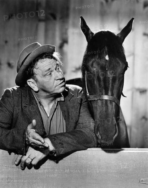Wallace Beery with Maiden Brave, on-set of the Film "Stable Mates", 1934