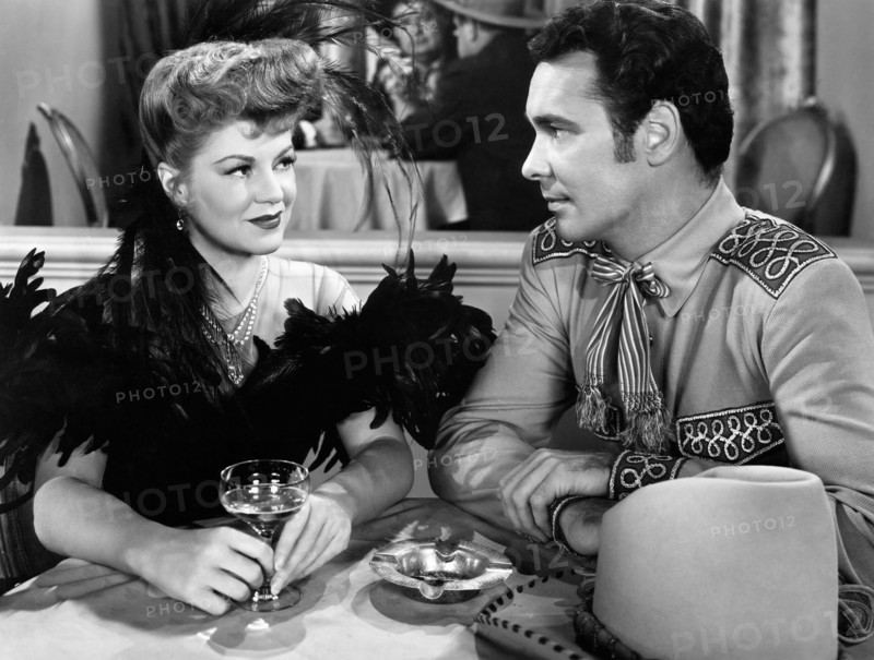 Claire Trevor, Barry Sullivan, on-set of the Film "The Woman of the Town", 1943