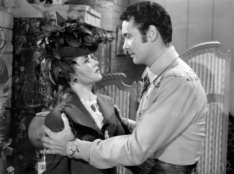 Claire Trevor, Barry Sullivan, on-set of the Film "The Woman of the Town", 1943