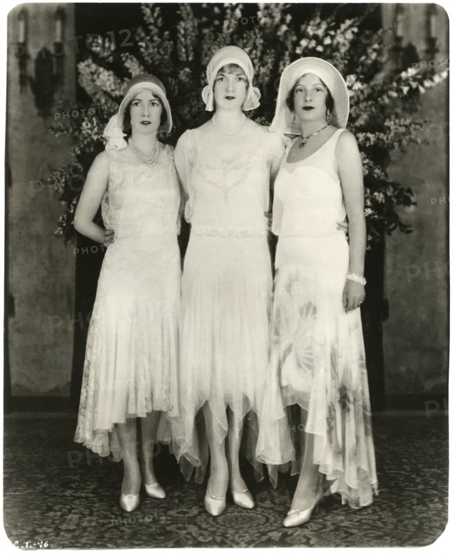 Portrait of Three Unidentified Actress in Fashionable Long Dresses with Uneven Hemlines, circa 1925