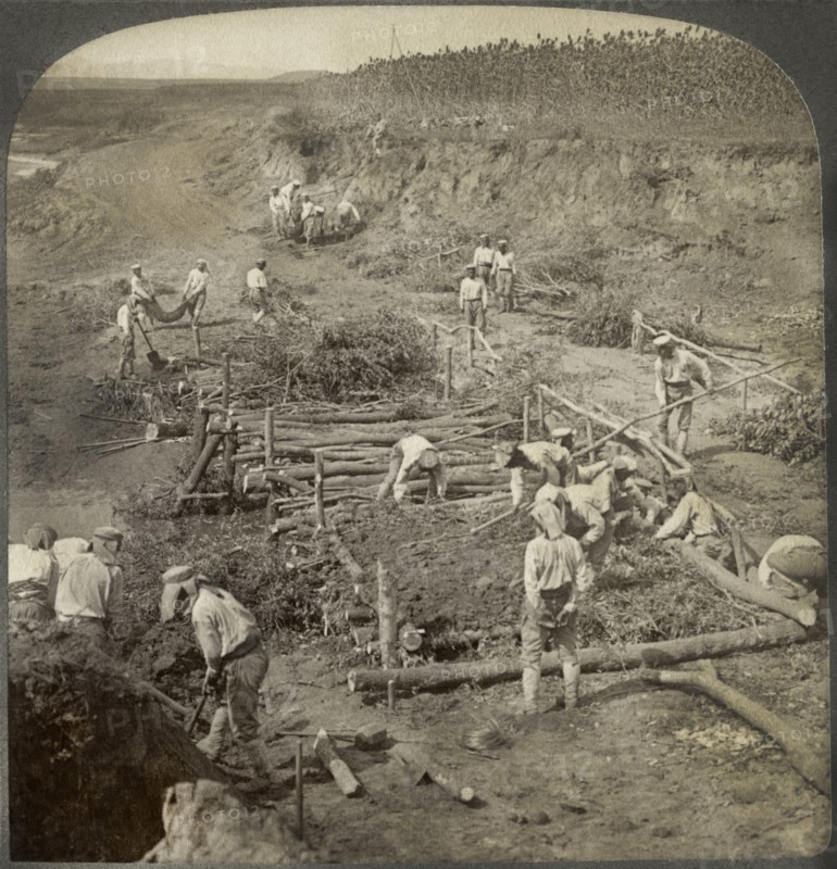 Japanese building a bridge of poles across a stream for the passage of troops in Manchuria, Single Image of Stereo Card, Underwood & Underwood, 1906