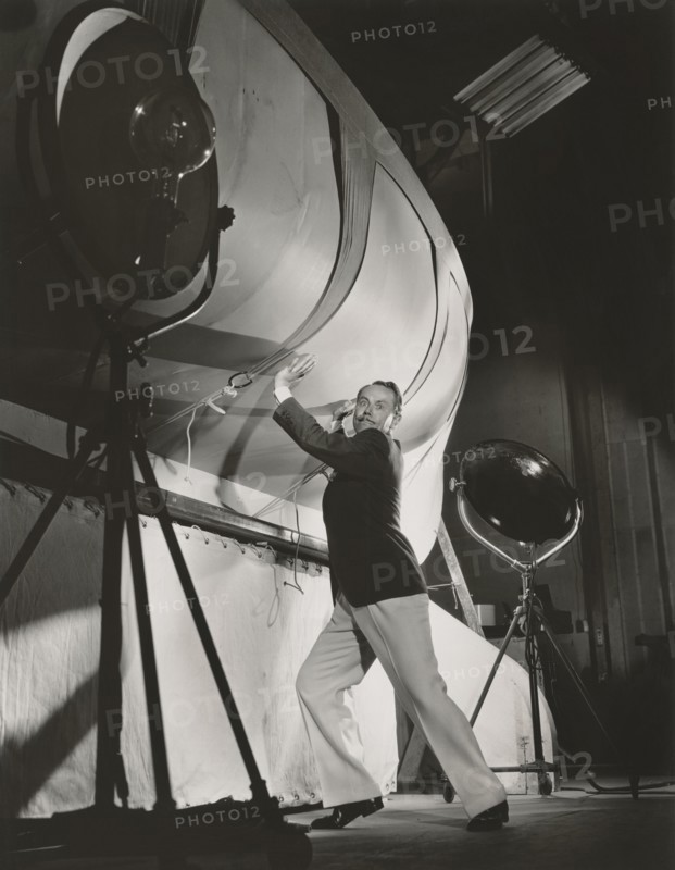 Charles Ruggles, Full-Length Publicity Portrait, On-set Attempting to Support a Stage Prop, Bert Longworth for Paramount Pictures, 1934