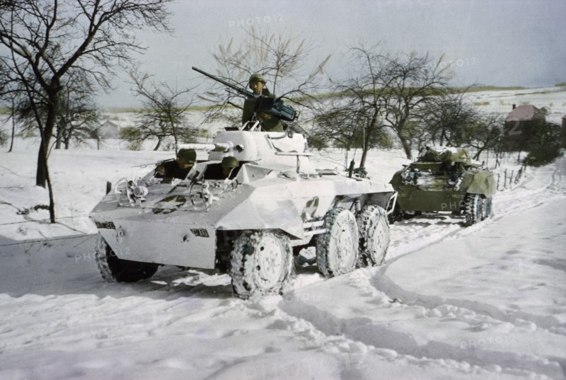 Camouflaged Light Armored Car M8 and one that was not Painted White, Ardennes-Alsace Campaign, Battle of the Bulge, 1945
