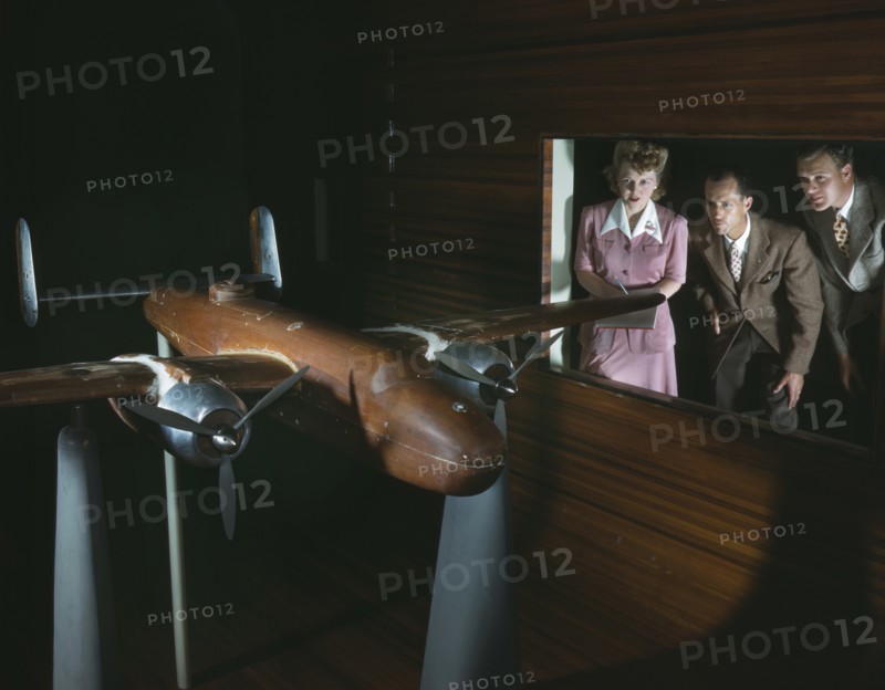 Members of Experimental Staff Observing Wind Tunnel Tests on Accurate Scale Model of B-25 Bomber, North American Aviation, Inc., Inglewood, California, USA, Alfred T Palmer for Office of War Information, October 1942