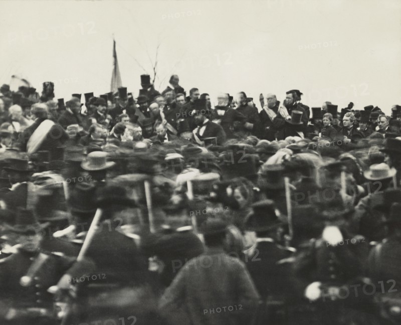 U.S. President Abraham Lincoln (without Hat below Flag slightly right) Standing Amongst Crowd during Dedication of Soldier's National Cemetery where he Delivered his Famous Speech, the Gettysburg Address, Gettysburg, Pennsylvania, USA, November 19, 1863