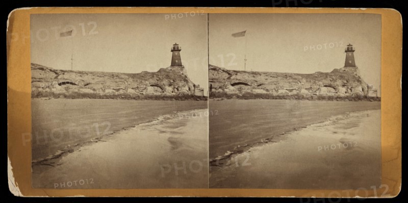 Lighthouse and U.S. Flag at Fort Sumter as seen from Beach at Morris Island, Charleston, South Carolina, Stereo Card, 1865