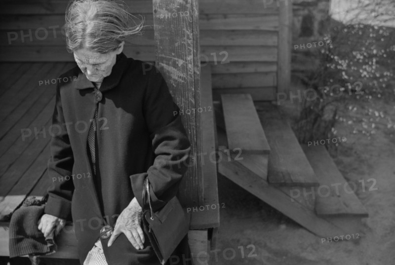 Depressed Woman sitting on Porch of Rural Home, near Whitestone, South Carolina, USA, Jack Delano, Farm Security Administration, March 1941
