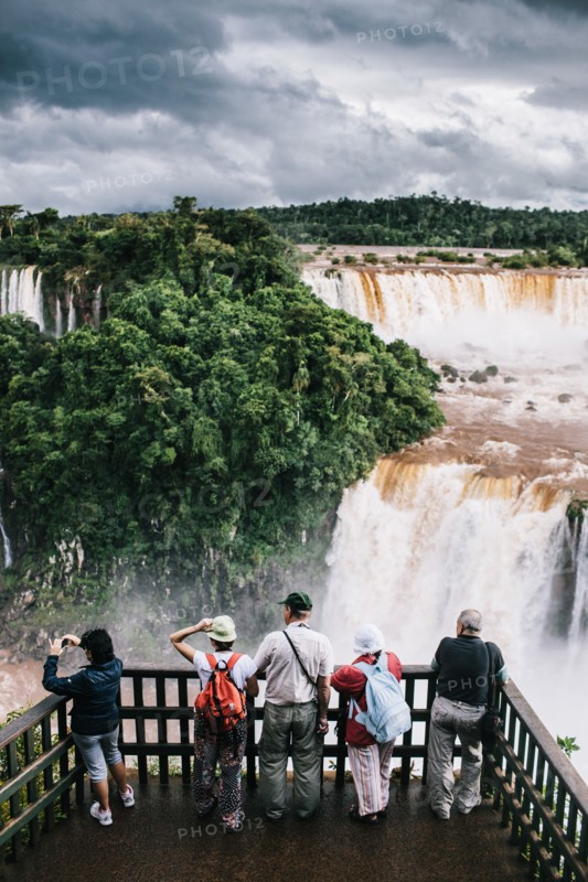 Rear View of Group of Tourists Viewing Waterfalls, Foz do Iguacu, Brazil