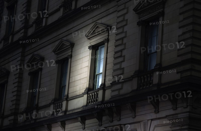 Spotlight on Exterior Window at Night