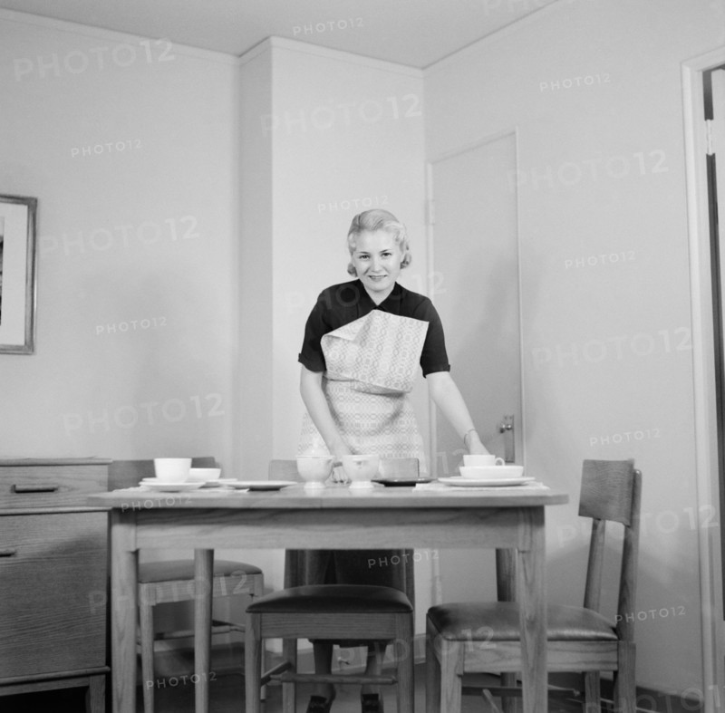 Woman Setting Table, Interior of Completed House, New Deal Cooperative Community, Greenbelt, Maryland, USA, Arthur Rothstein, Farm Security Administration, November 1936