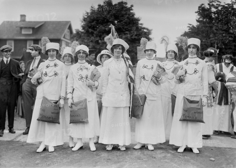 Elisabeth Freeman (center holding American flag) with Suffrage News Girls, Bains News Service, May 1913