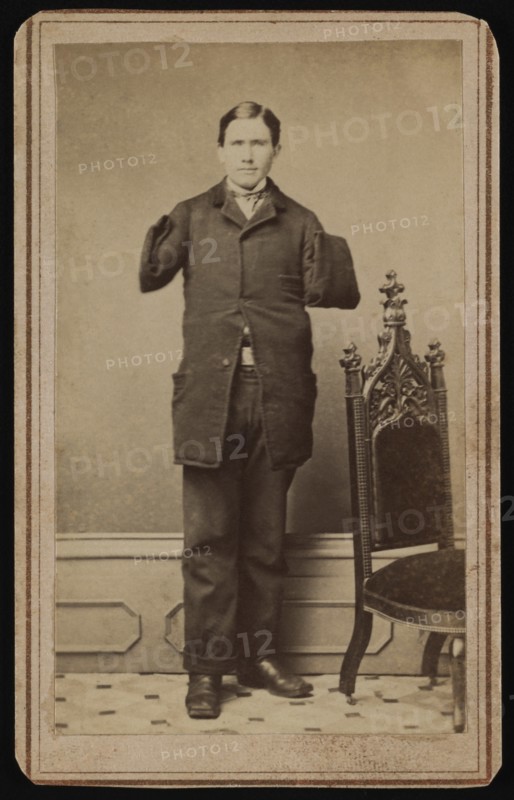Richard D. Dunphy, former U.S. Navy Sailor with Amputated Arms, was Coal Heaver aboard USS Hartford during American Civil War and was Wounded during Battle of Mobile Bay, Awarded Congressional Medal of Honor, Full-length Standing Portrait, 1864