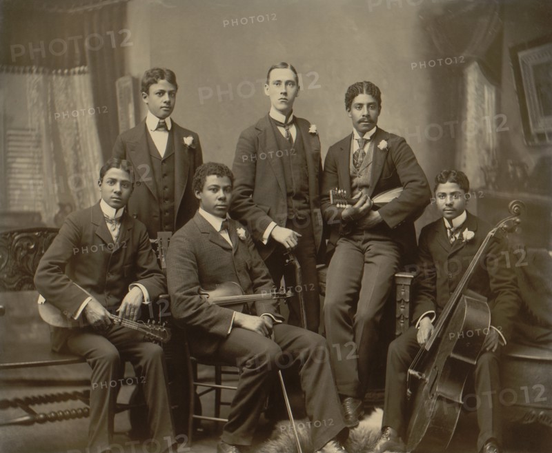 Portrait of Group of Young Musicians with Various String Instruments, rom left: Photographer's Twin Sons Clarence and Norman Askew, son Arthur Askew, neighbor Jake Sansome, and sons Robert and Walter Askew, Photo by Thomas E. Askew, 1899