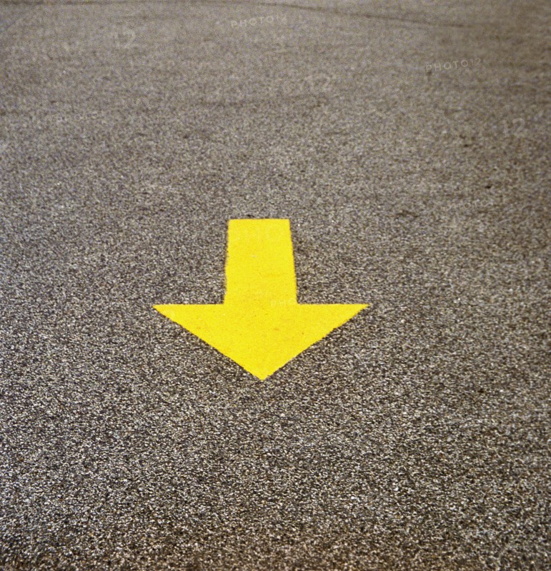 Yellow Arrow on Concrete