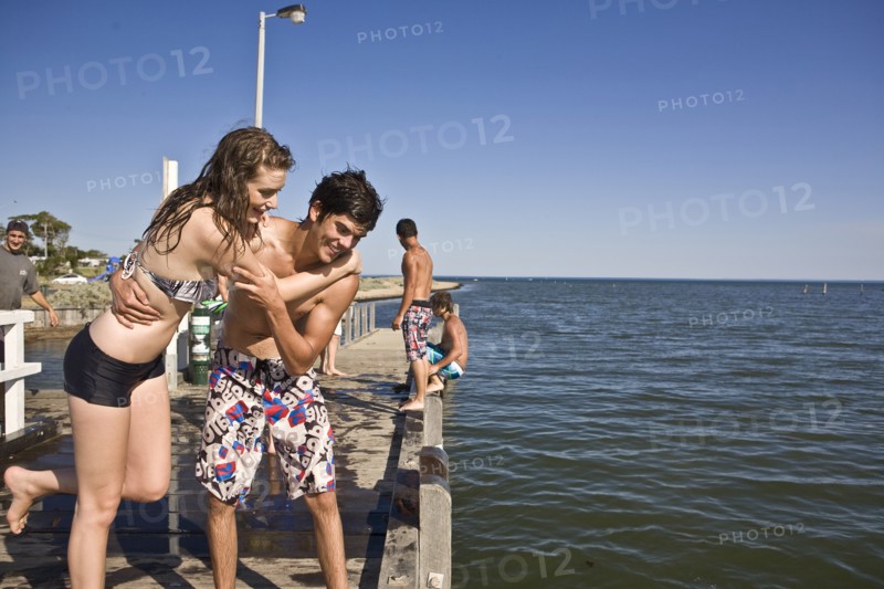Playful Young Couple on Pier
