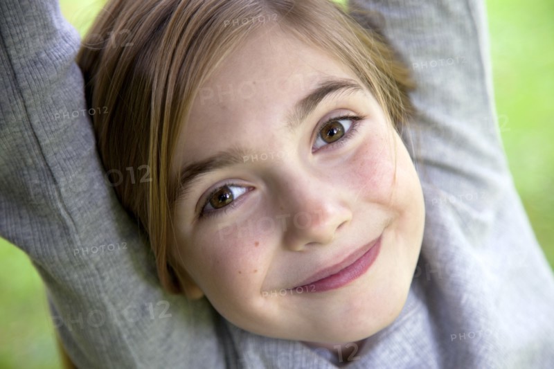 Smiling Girl With Arms Up