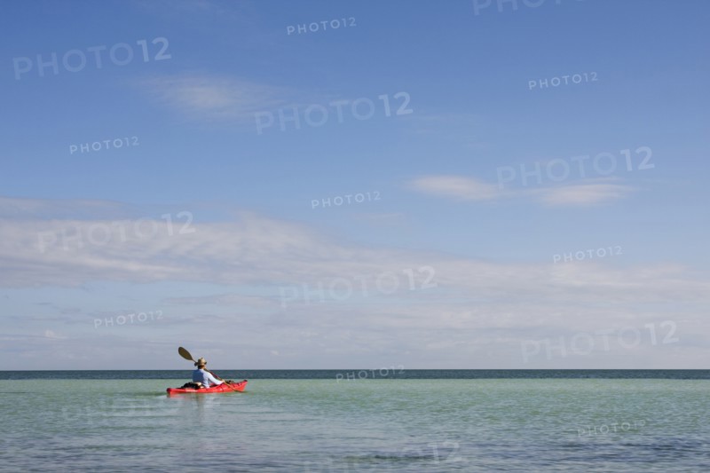 Man Kayaking on Ocean, Florida Keys, USA