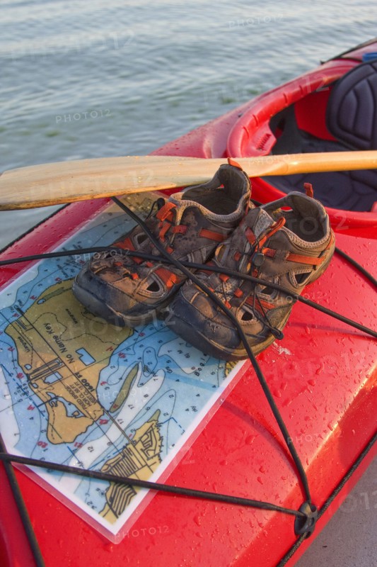 Water Shoes and Map Strapped to Kayak, Close-Up
