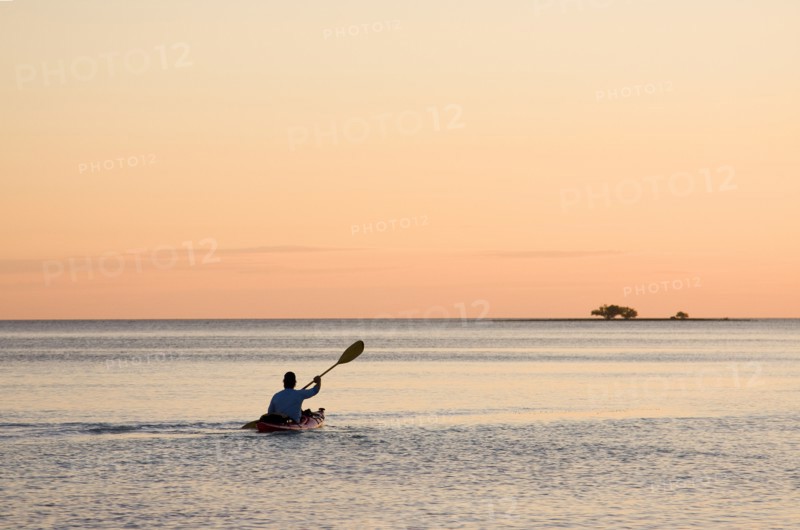 Man Kayaking at Sunset, Florida Keys, USA