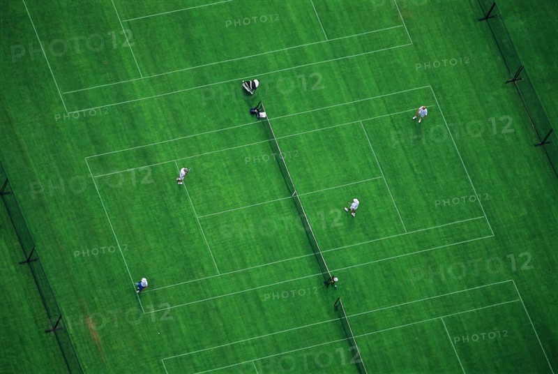 Doubles Tennis Match on Green Court, High Angle View