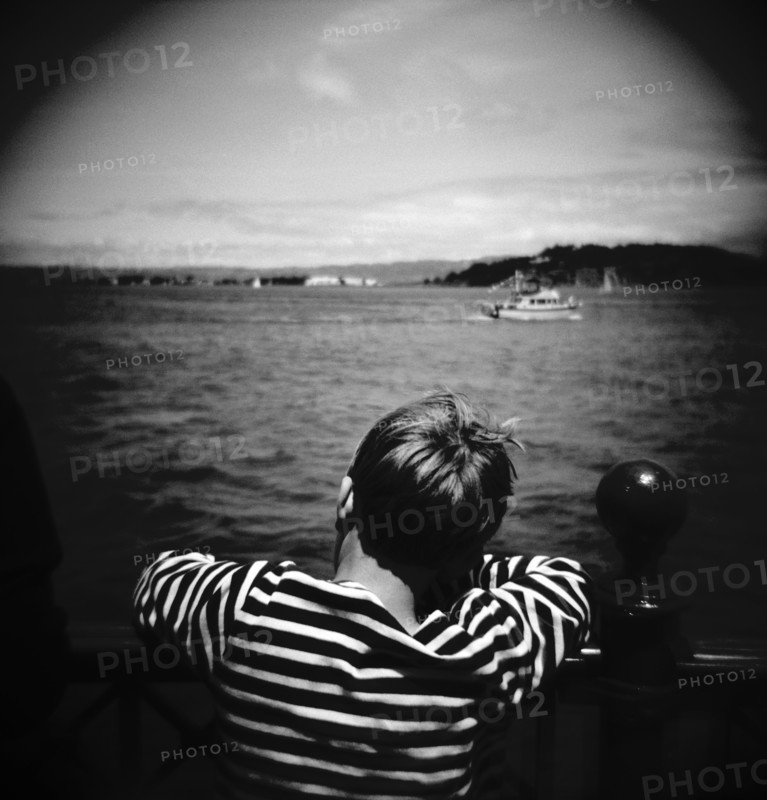 Boy Looking Out Over the Water
