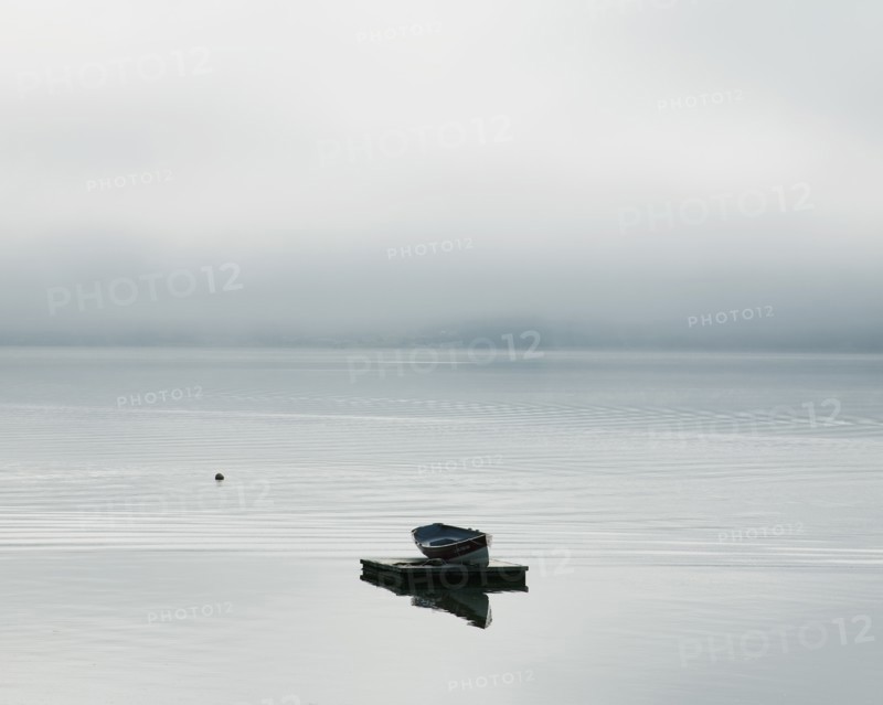 Rowboat Floating on a Dock