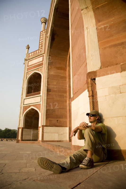 Man Sitting Against Humayun's Tomb, New Delhi, India