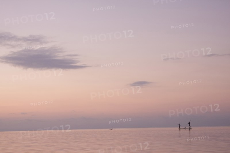 Two Men Fishing in Boat on Calm Water, Florida Keys, USA