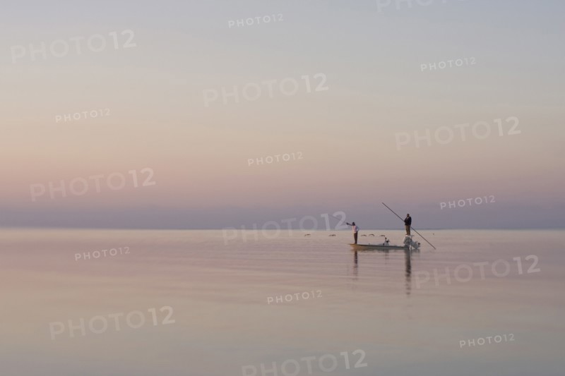 Two Men Fishing in Boat on Calm Water, Florida Keys, USA