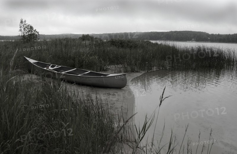 Beached Canoe on Small Lake
