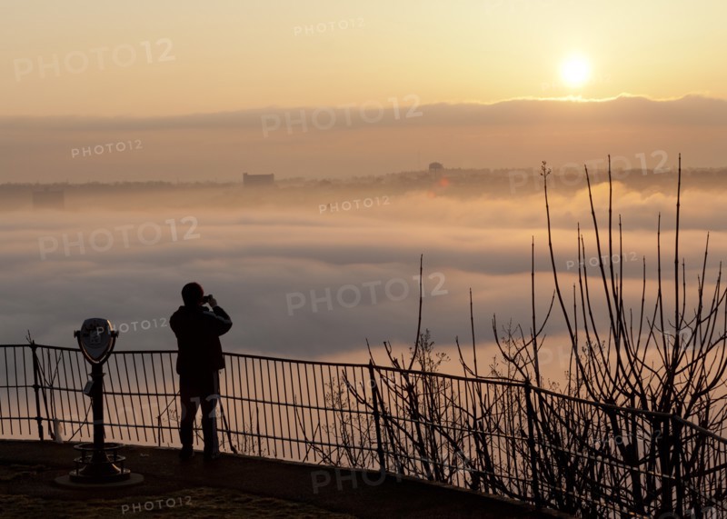 Person Photographing Fog Over River
