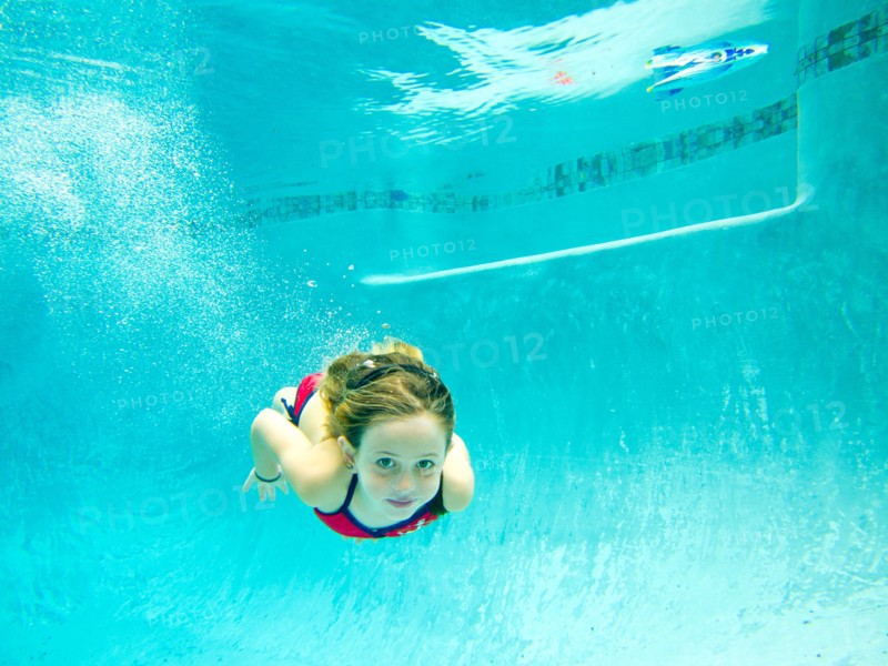 Girl Swimming Underwater in Pool, Eye Contact 2