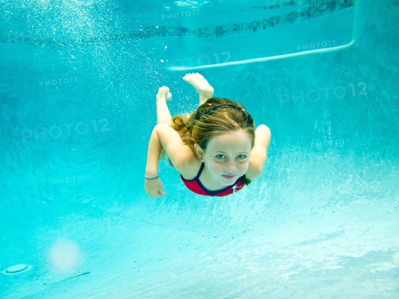 Girl Swimming Underwater in Pool, Eye Contact 3