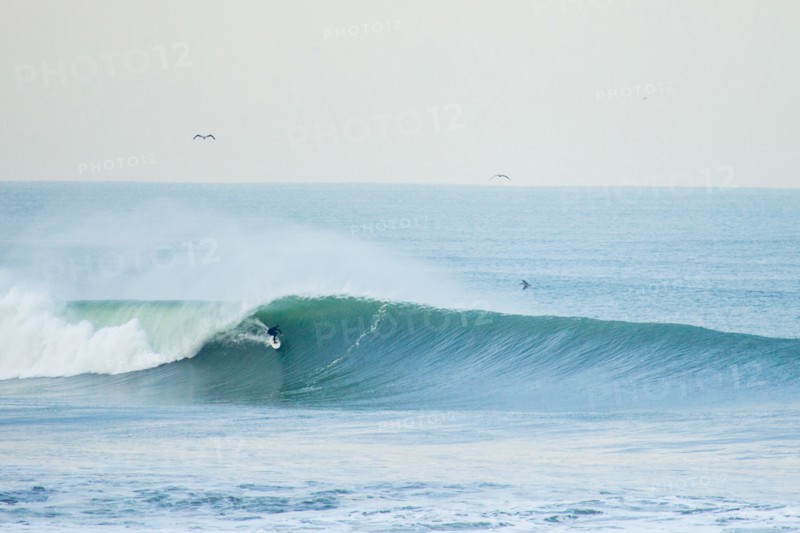 Surfer in Wetsuit Riding Wave, San Francisco, California, USA