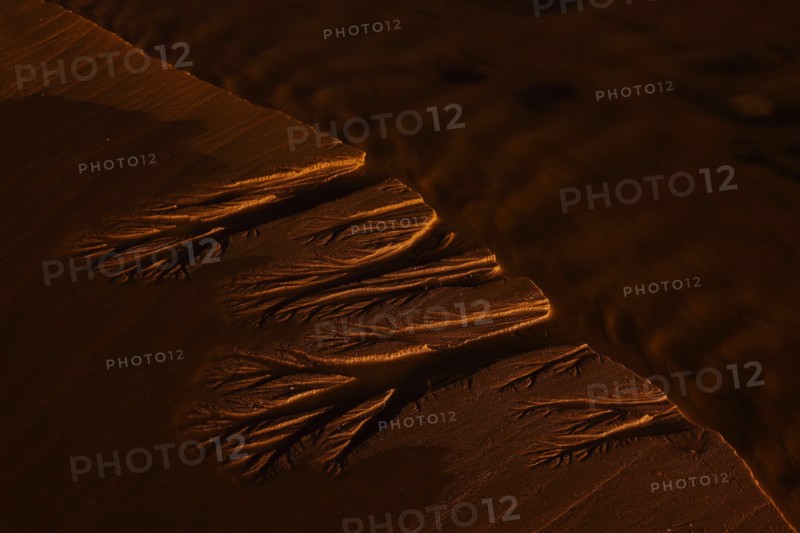 Water Making Pattern in Beach Sand
