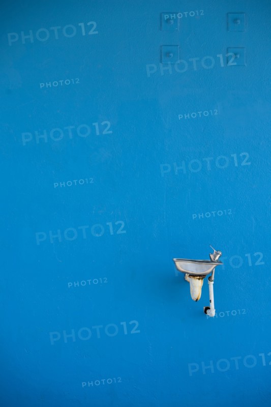 Water Fountain Against Blue Wall
