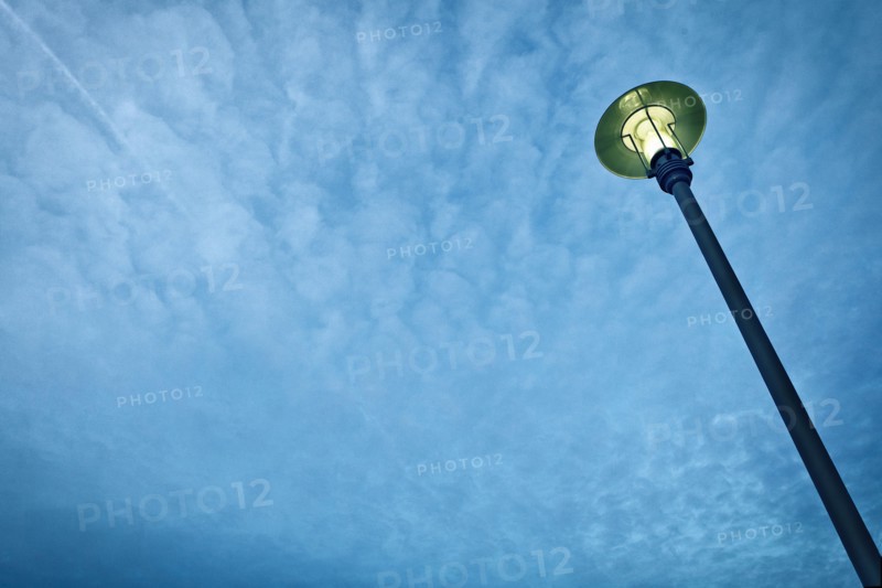 Street Light Against Blue Sky With Clouds