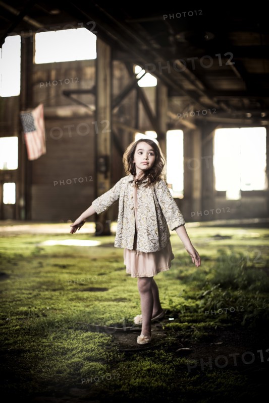Young Girl Dancing in Abandoned Warehouse