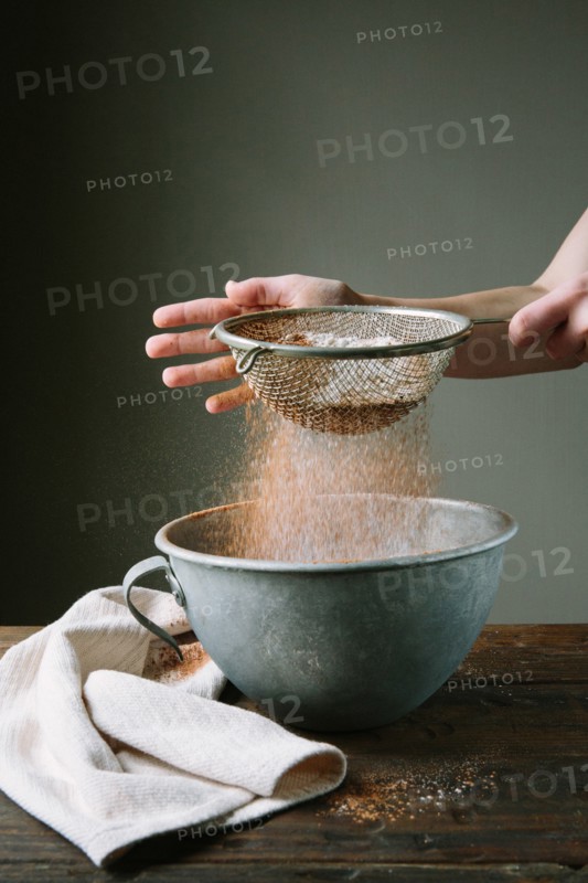 Flour and Cake Mix Being Sifted into Bowl