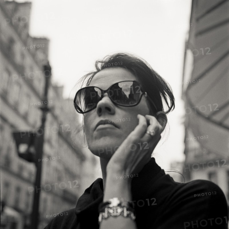 Woman Wearing Dark Sunglasses, Portait, Low Angle View, Paris, France