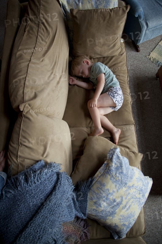 Young Boy Sleeping on Couch, High Angle View
