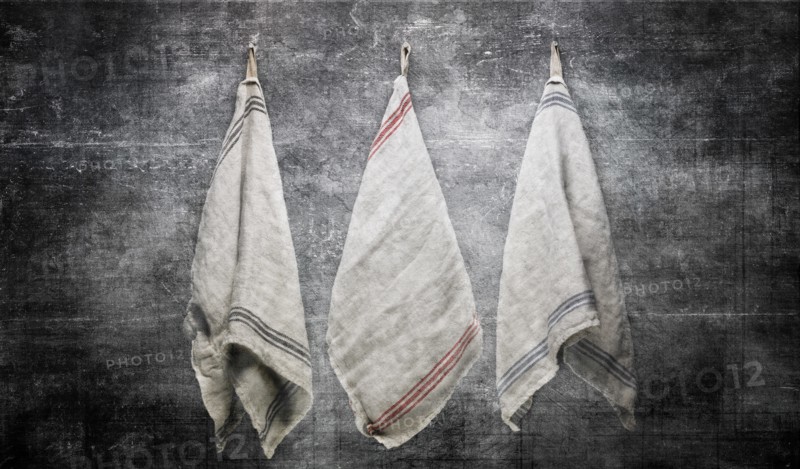 3 Linen Towels Hanging on Slate Gray Stone Wall