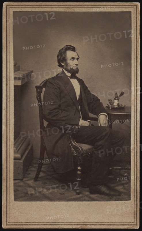 Full-Length Seated Portrait of Abraham Lincoln, his first sitting for a Portrait, Washington DC, USA, Photograph by Alexander Gardner, 1861