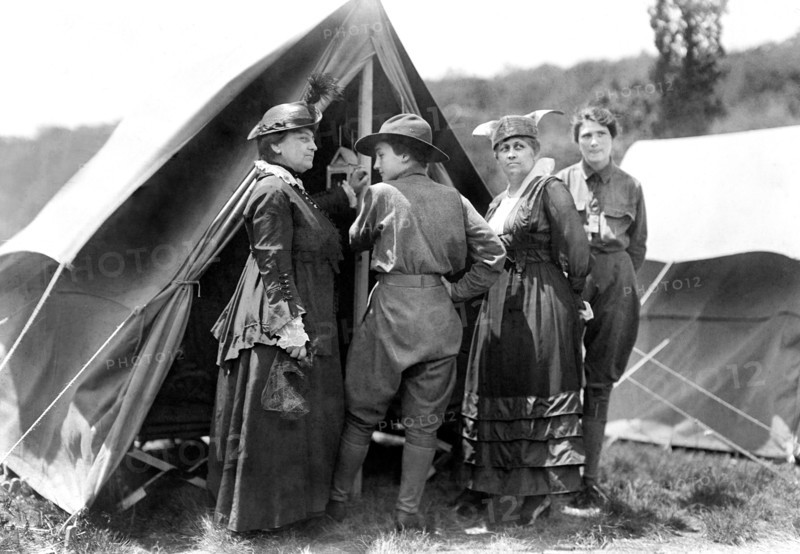 Mary Dimmick Harrison, wife of President Benjamin Harrison and her daughter Elizabeth Harrison Walker with Mrs. Green and probably her daughter, Helen standing at tent of Emergency Services Corps camp where young women were trained in shooting, military drills, hiking and other activities by Army officers, on the estate of Mr. and Mrs. Edward Hewitt, Passaic County, New Jersey, USA, Bain News Service, 1916