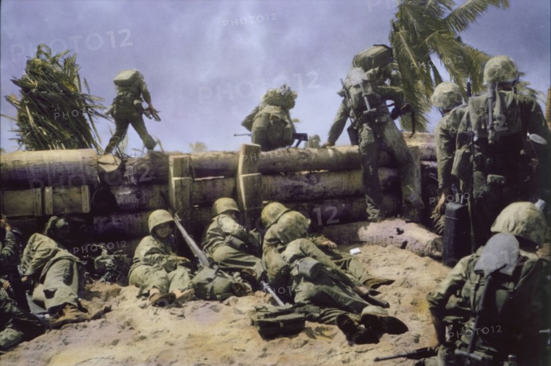 U.S. Marines Climbing over Coconut Log Seawall during Battle of Tarawa, Tarawa Atoll, Gilbert Islands, November 1943