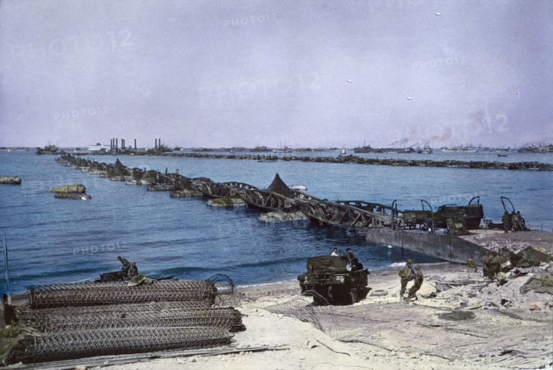 U.S. Military Vehicles crossing Pontoon Bridge to Omaha Beach from Temporary Mulberry Harbour A, Normandy, France, June 16, 1944