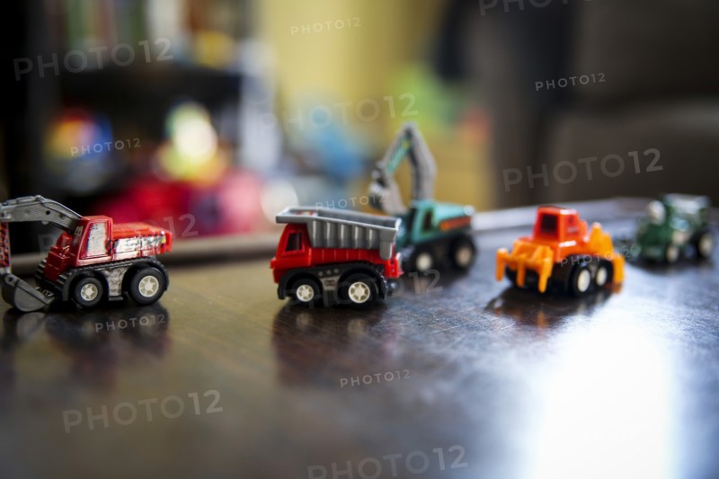 Miniature Toy Trucks on Table