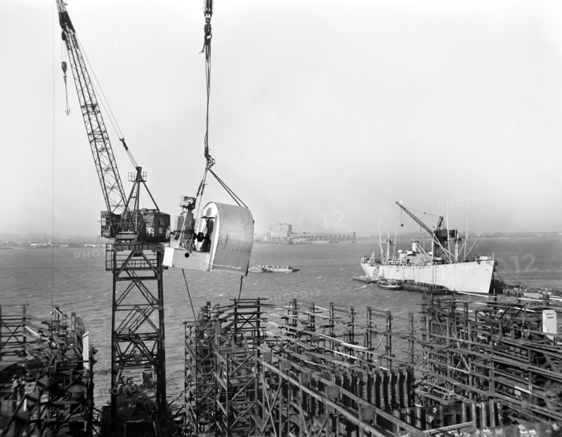 Large Blower being Hoisted into place during Construction of Liberty Ship Frederick Douglass, Bethlehem-Fairfield Shipyards, Baltimore, Maryland, USA, Roger Smith, U.S. Office of War Information, May 1943